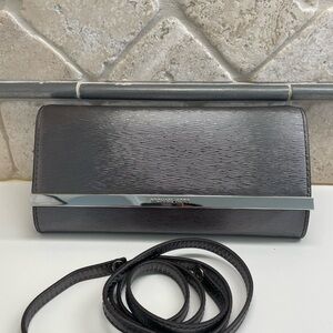 Michael Kors Metallic Silver Clutch with Strap.